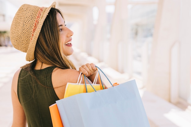 Smiley woman with shopping bags Free Photo